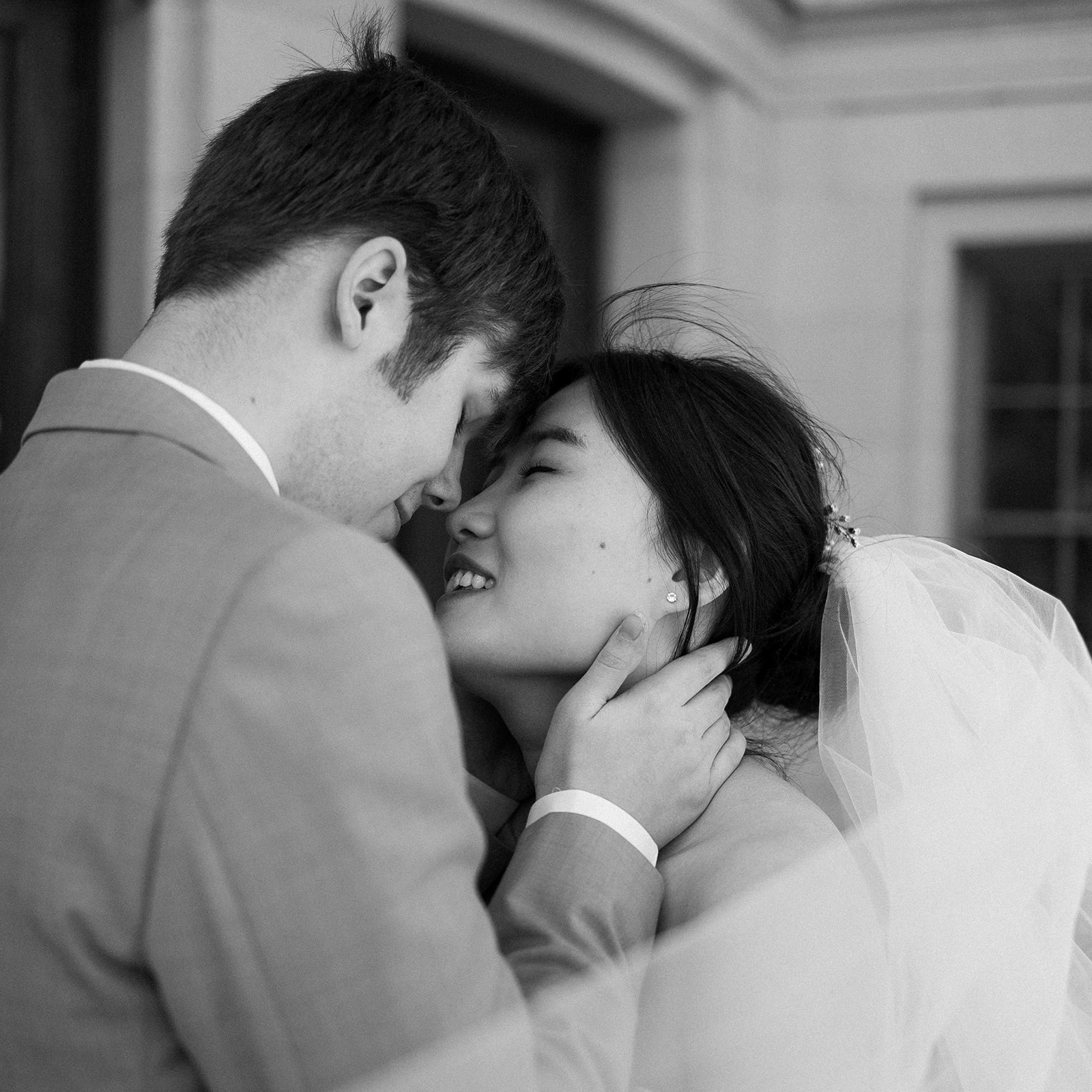 bride and groom embrace on their elopement day at the wisconsin state capitol