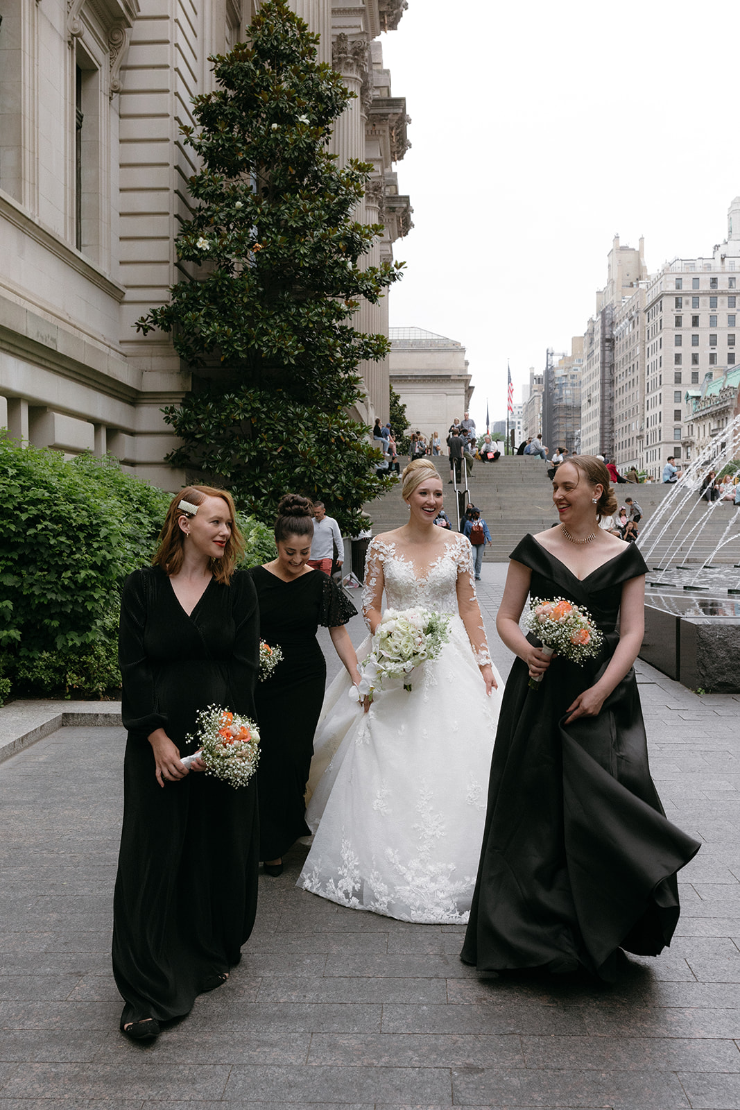 Bridesmaids walk together at The Met Museum for a wedding day in NYC