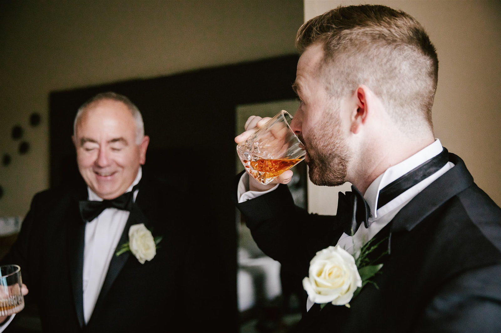 Groom's getting ready includes a classic whiskey toast, setting the tone for a day filled with celebration.