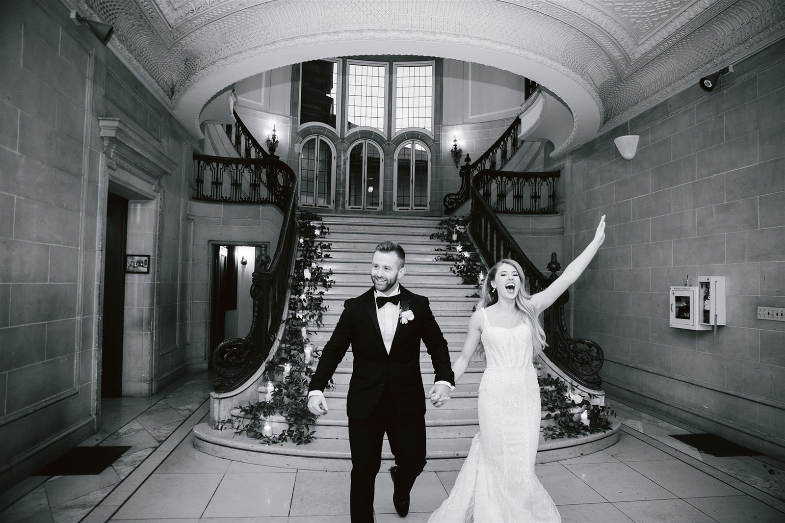 The staircase at Armour House is a majestic backdrop as the bride and groom make their entrance.