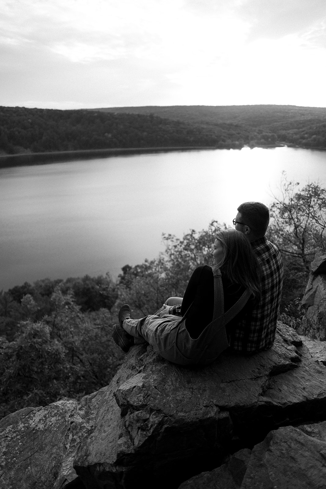 couple holds each other as they look out onto Devil's Lake State Park in Baraboo, Wisconsin.