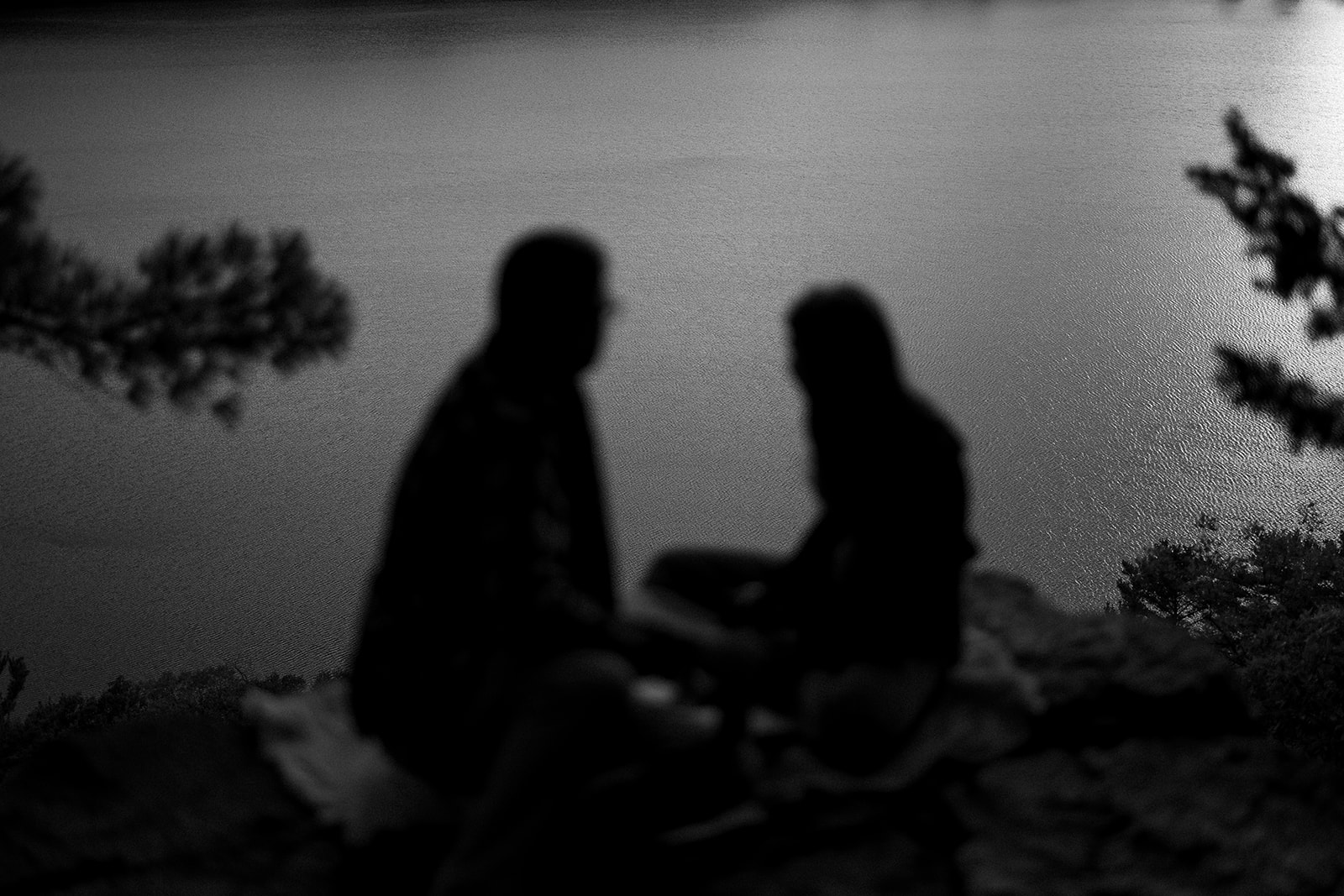 couple rests on the bluffs at Devil's Lake State Park in Baraboo, Wisconsin.
