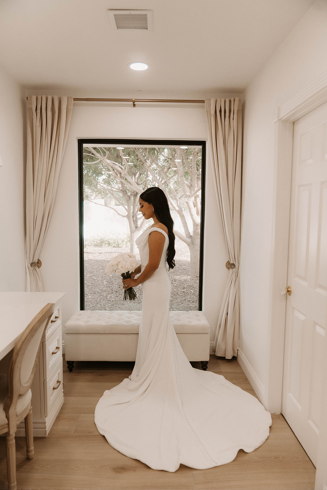 Bride getting ready in bridal suite in Arizona wedding venue. 