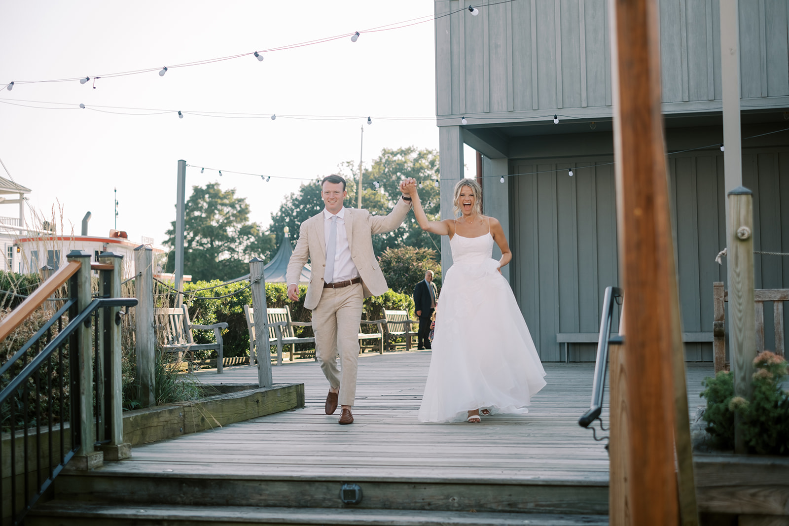 bride and groom enter the reception tent for saint michaels maryland wedding