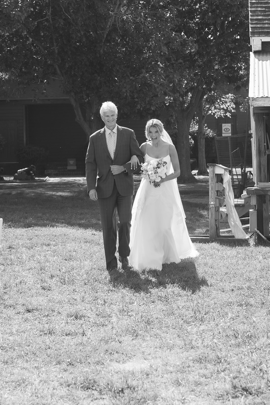 father and bride walking down the aisle at saint michaels wedding