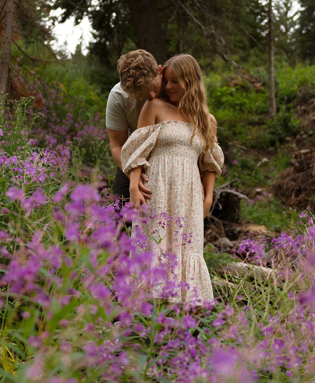 Magical and romantic evening in the Utah mountains, surrounded by purple flowers, lush greens and the pines