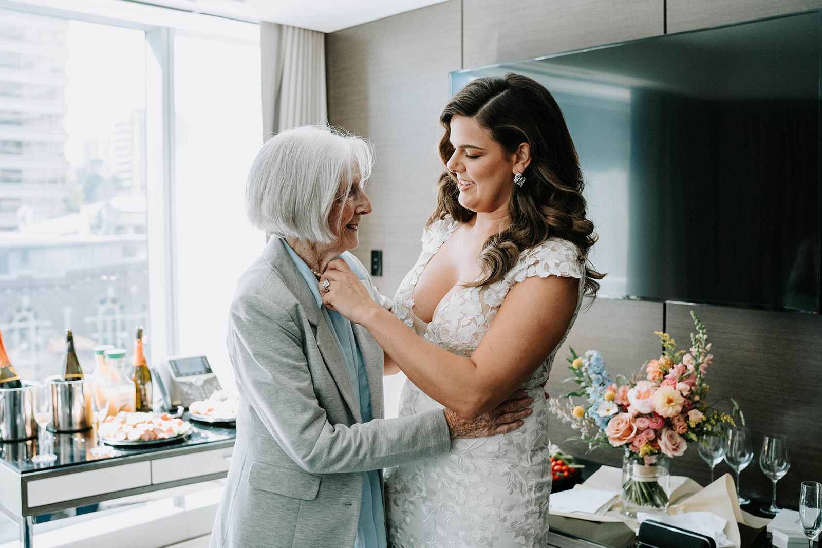 bride and grandmother laughing