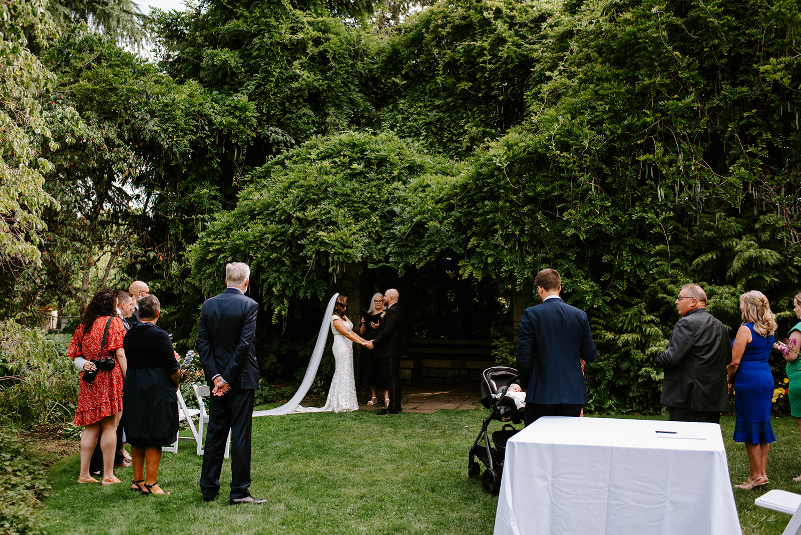 outdoor wedding ceremony at Van Dusen Botanical Gardens in Vancouver