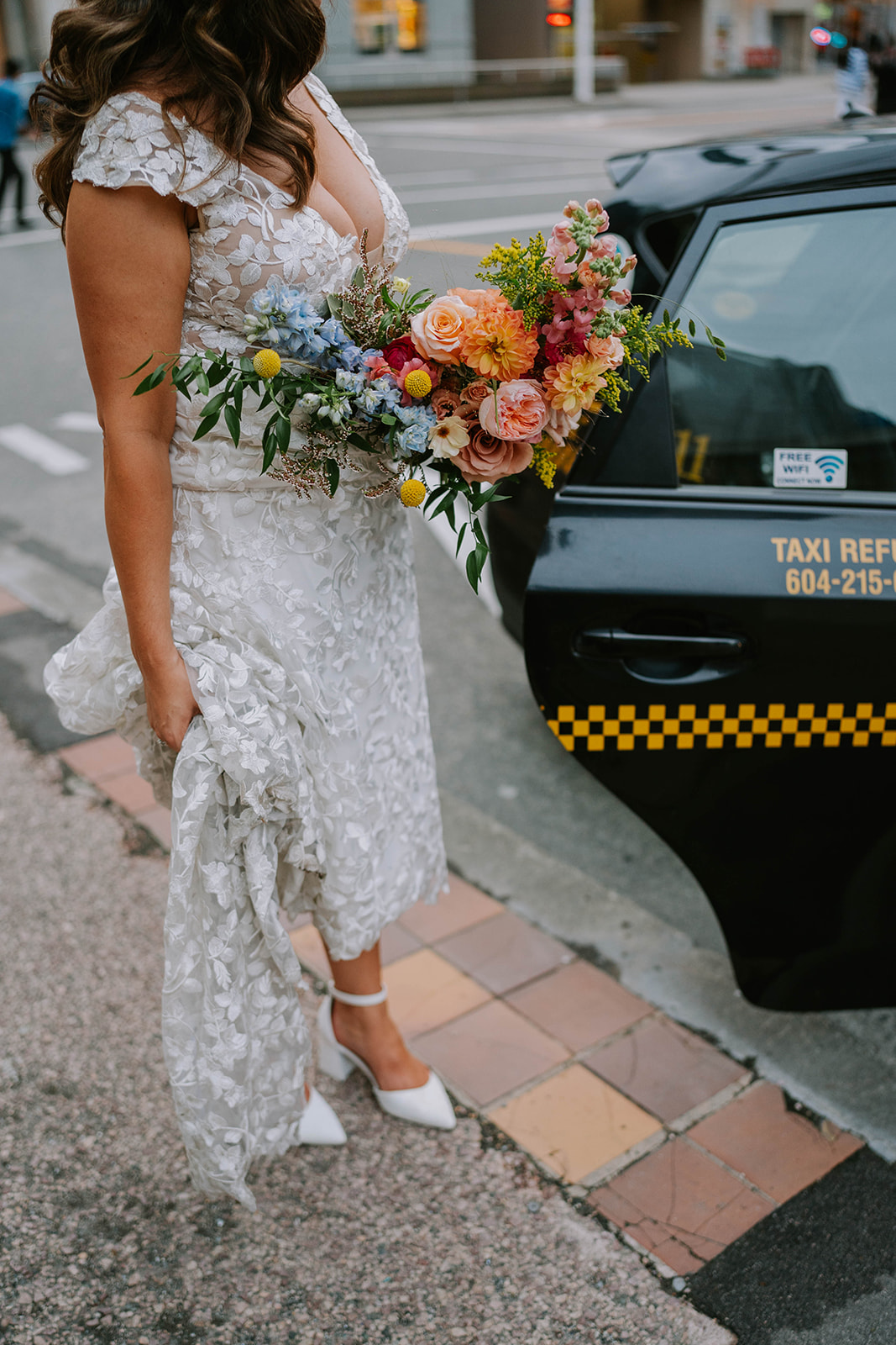 bride getting into taxi