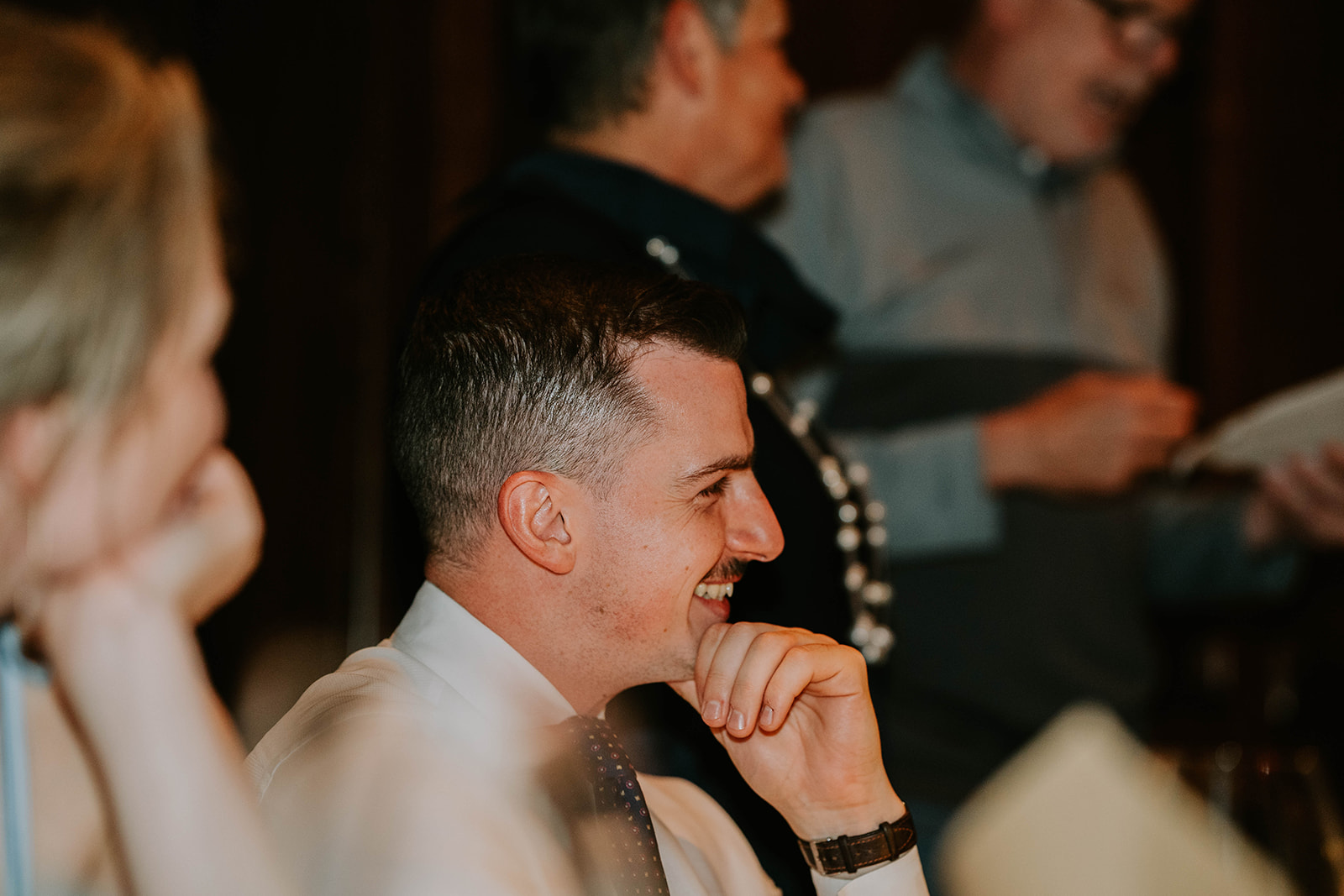 wedding guest laughing during wedding reception