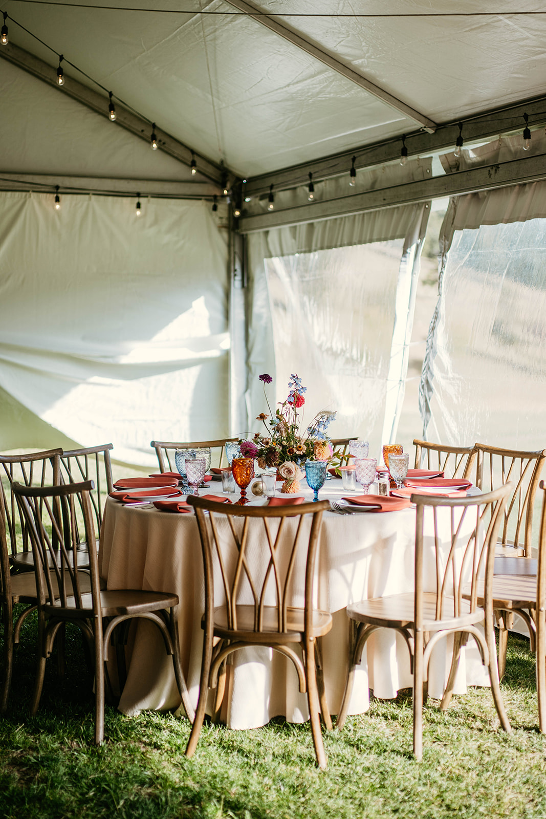 colorful garden style tent wedding reception decor