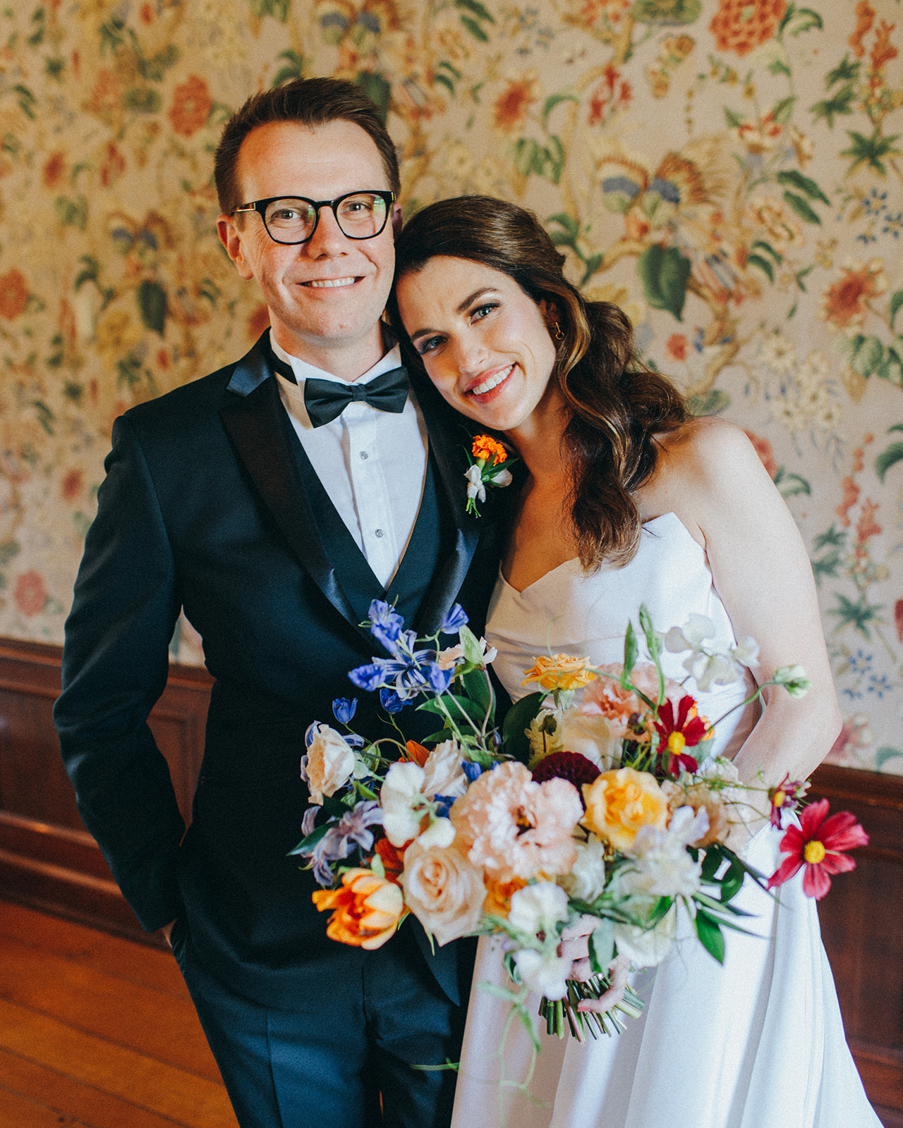 A couple has a colorful wedding day at West Michigan's famous Felt Mansion in Saugatuck, MI