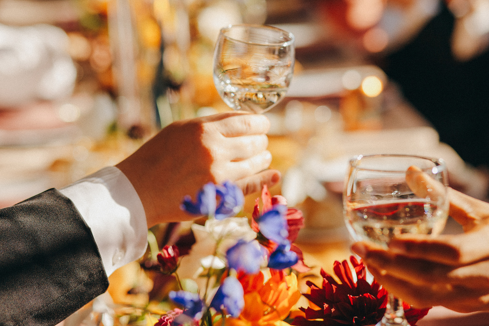 People toasting during a colorful September Fall wedding in West Michigan