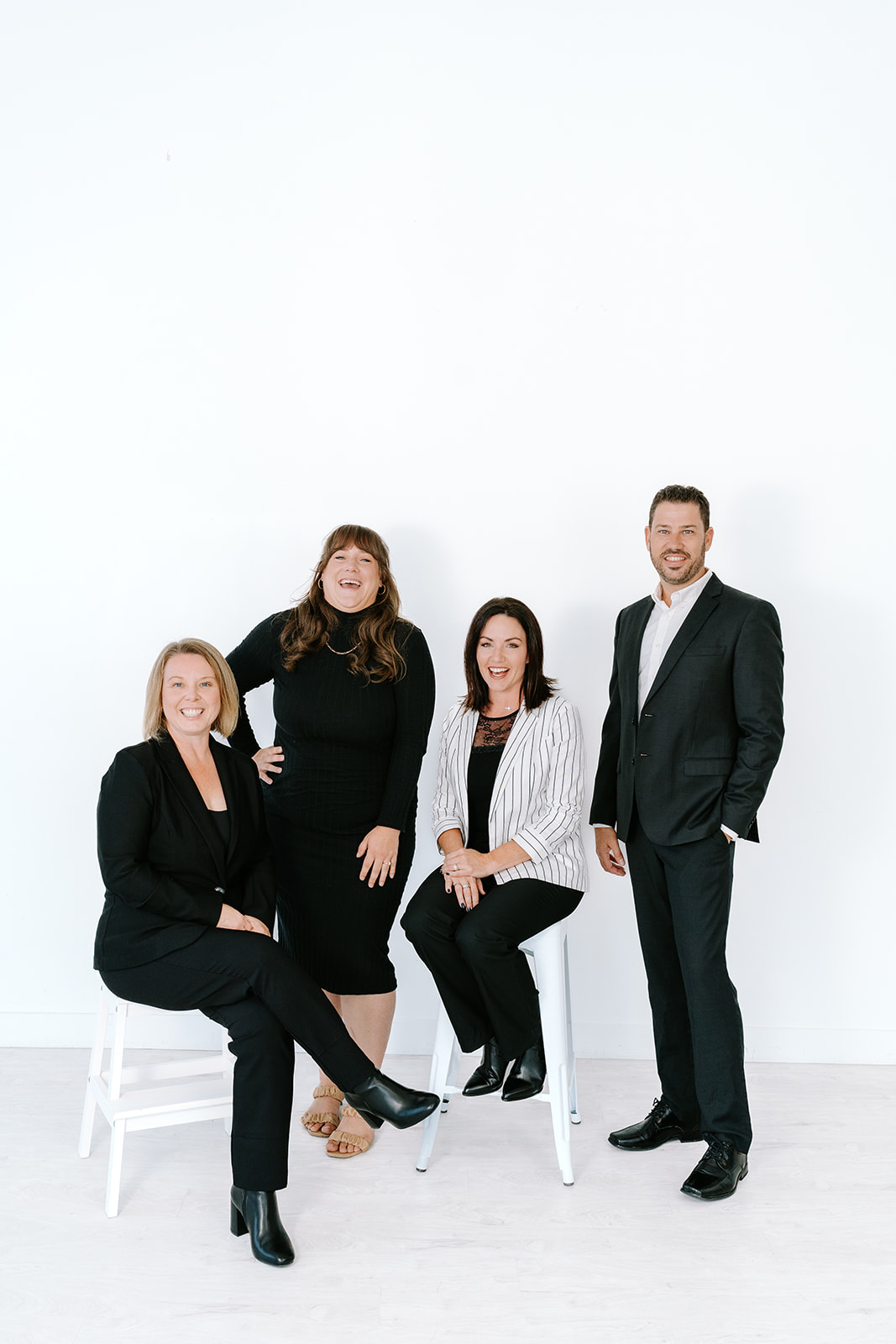 group of real estate agents in black and white