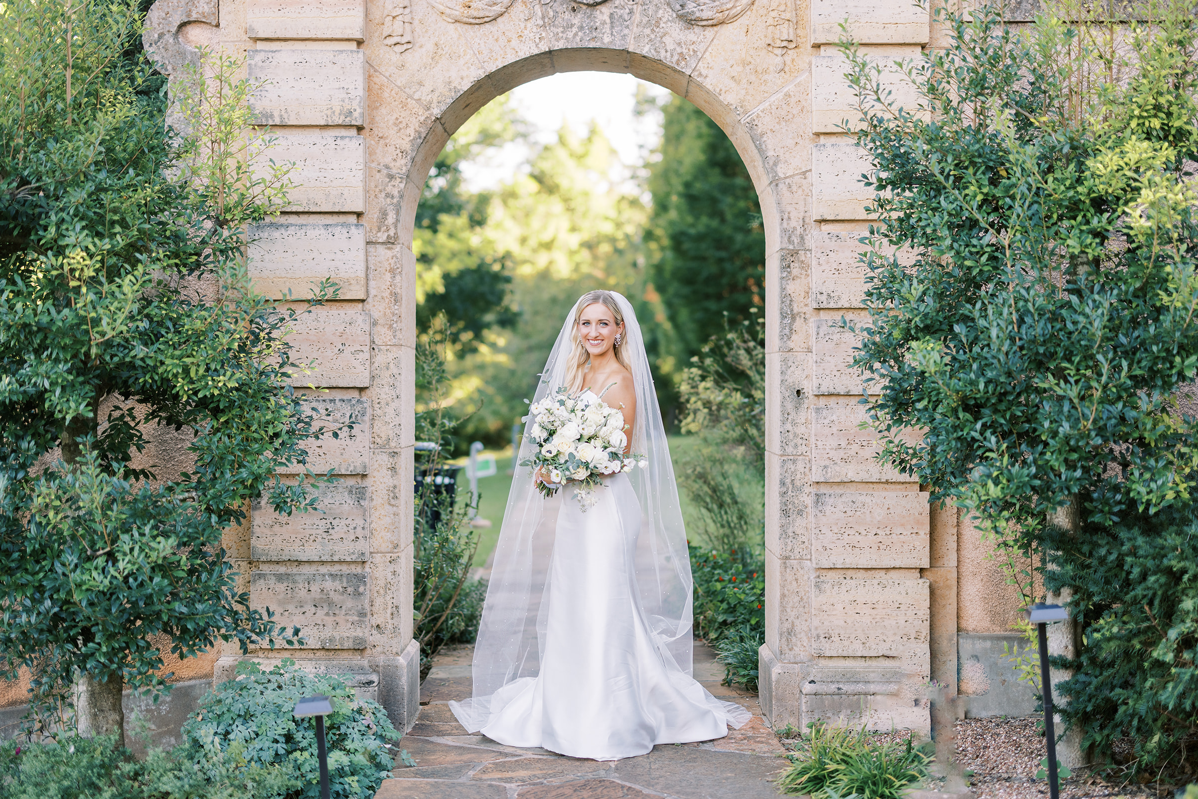 A bride in the gardens at Philbrook museum