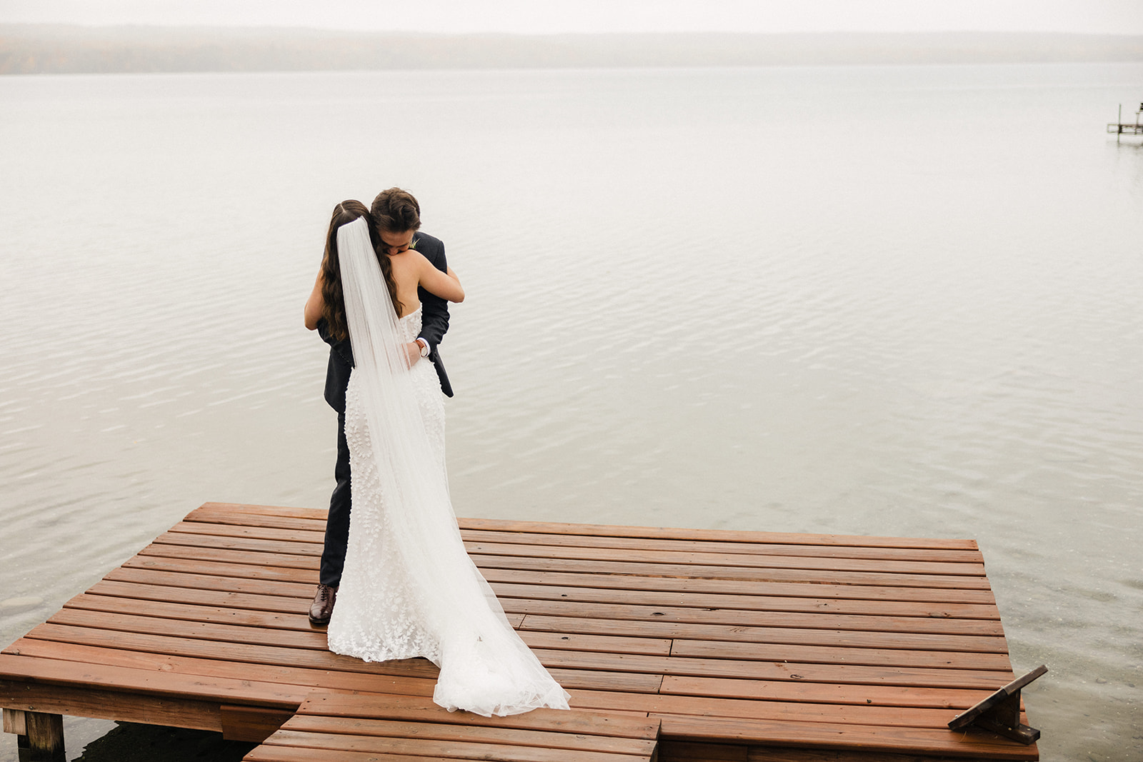 bride and groom on dock at Sugar Lake lodge