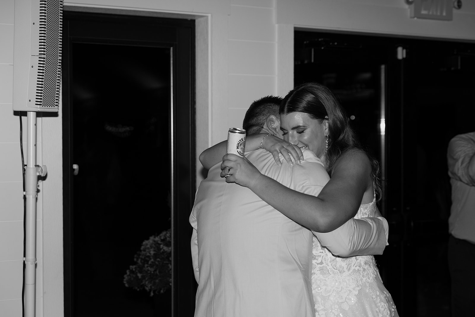 Bride and groom hugging on the dance floor