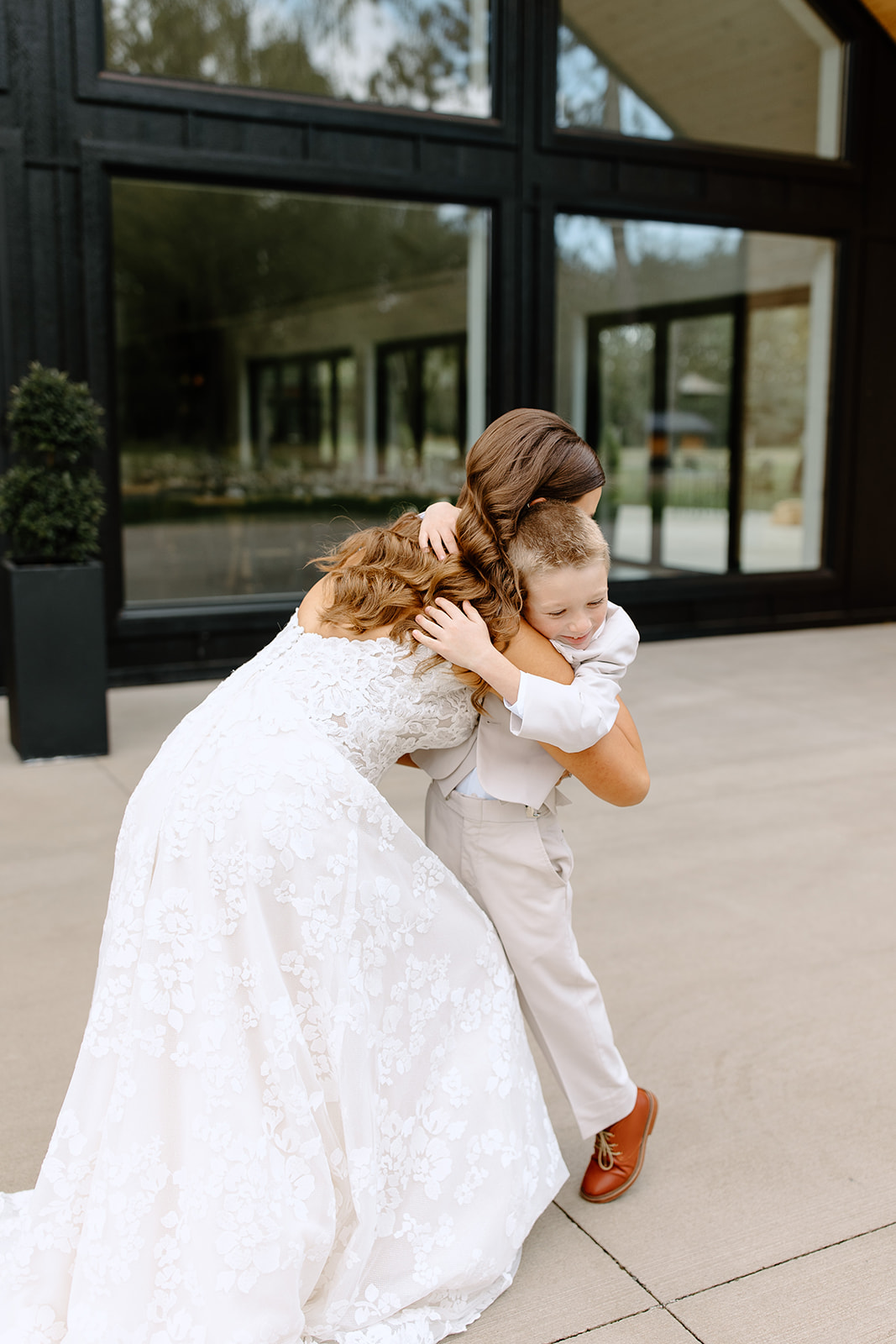 Bride hugging her son