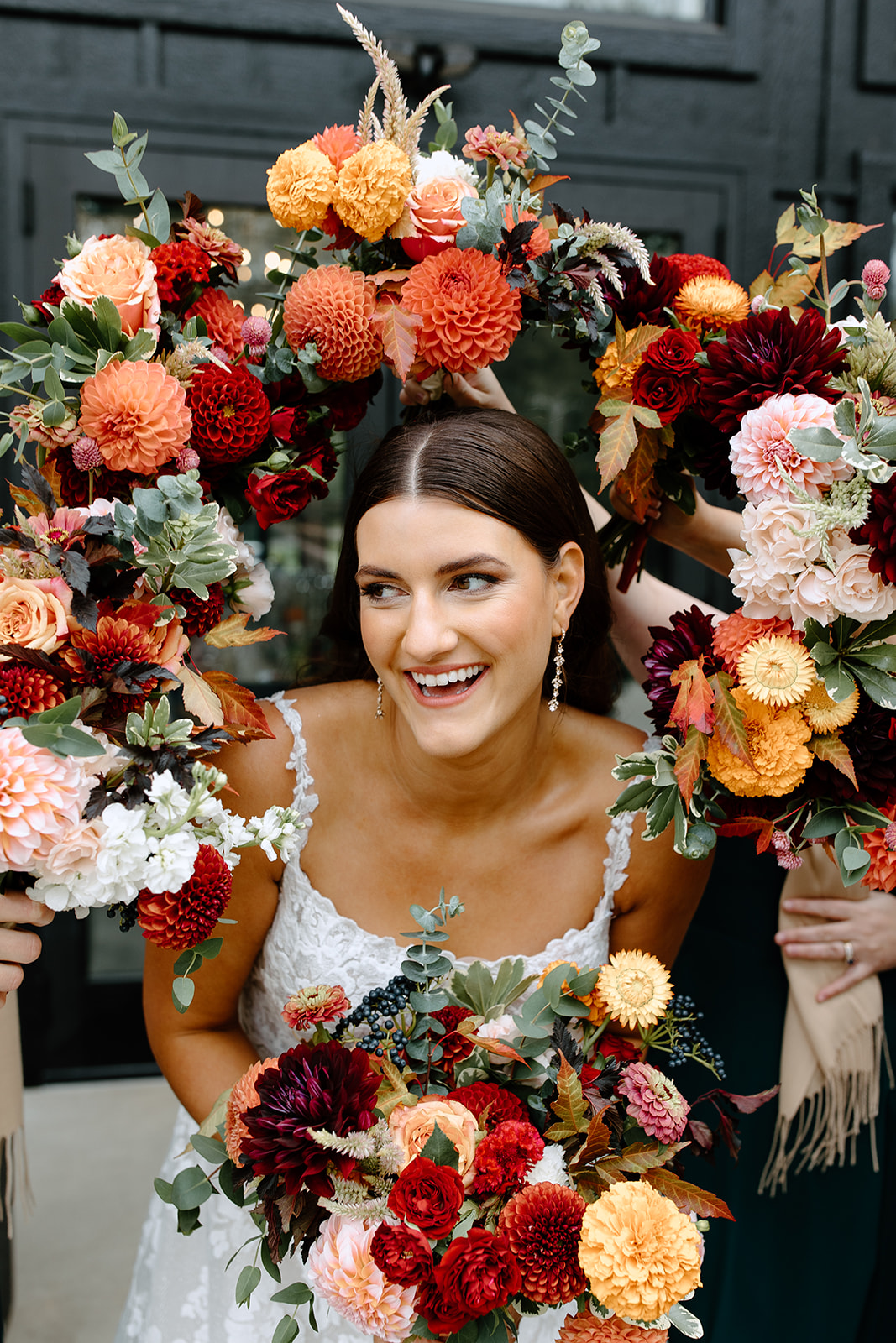 Bride surrounded by bouquets