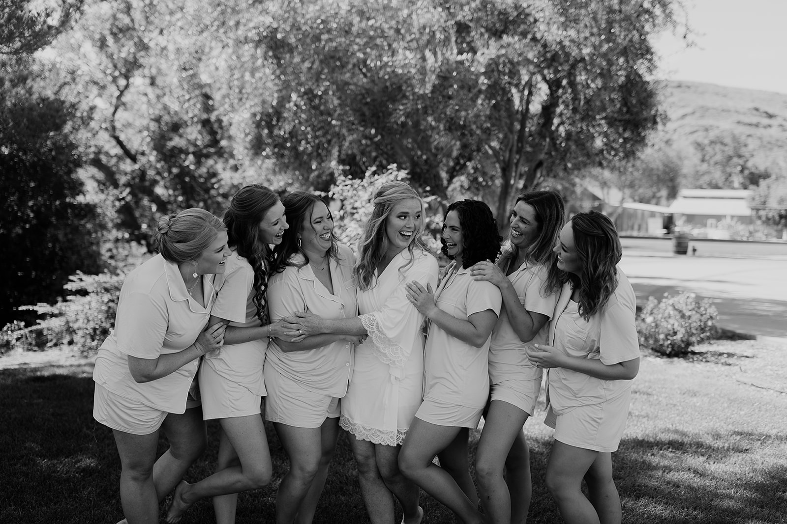 Bride and bridesmaids sharing laughter and joy during the getting ready session at Higuera Ranch