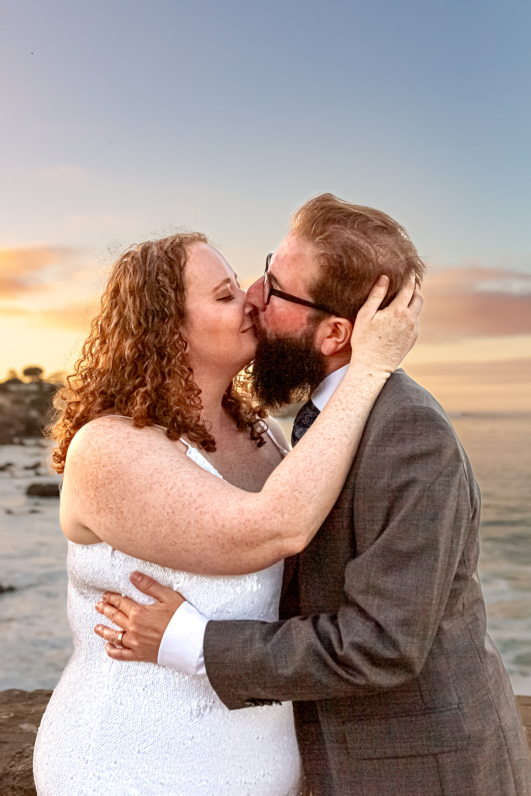 bride and groom kiss monterey wedding lovers point