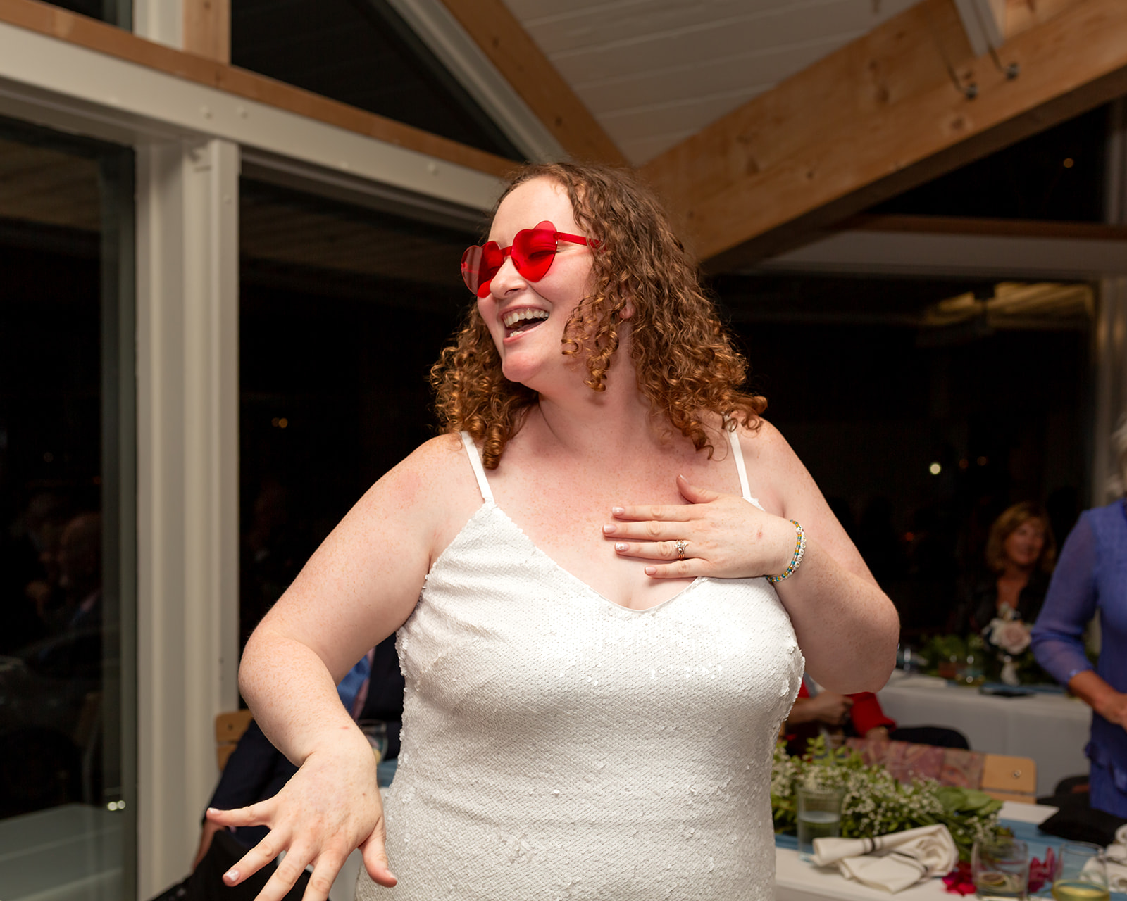swiftie bride in sequin dress and heart shaped sunglasses