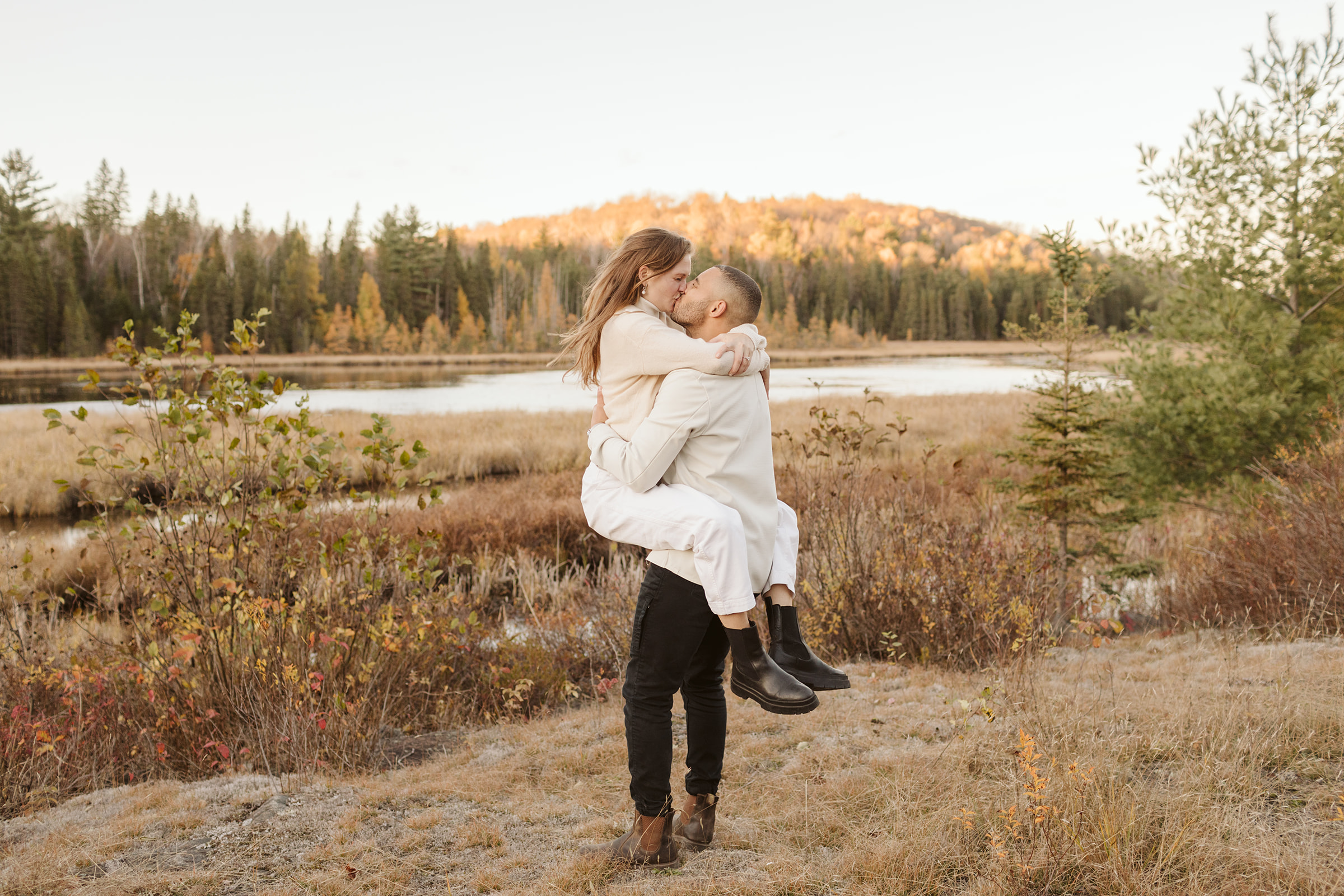 Engagement photos of this sweet couple at Algonquin Park who hiked, popped champagne and canoed at golden hour. 