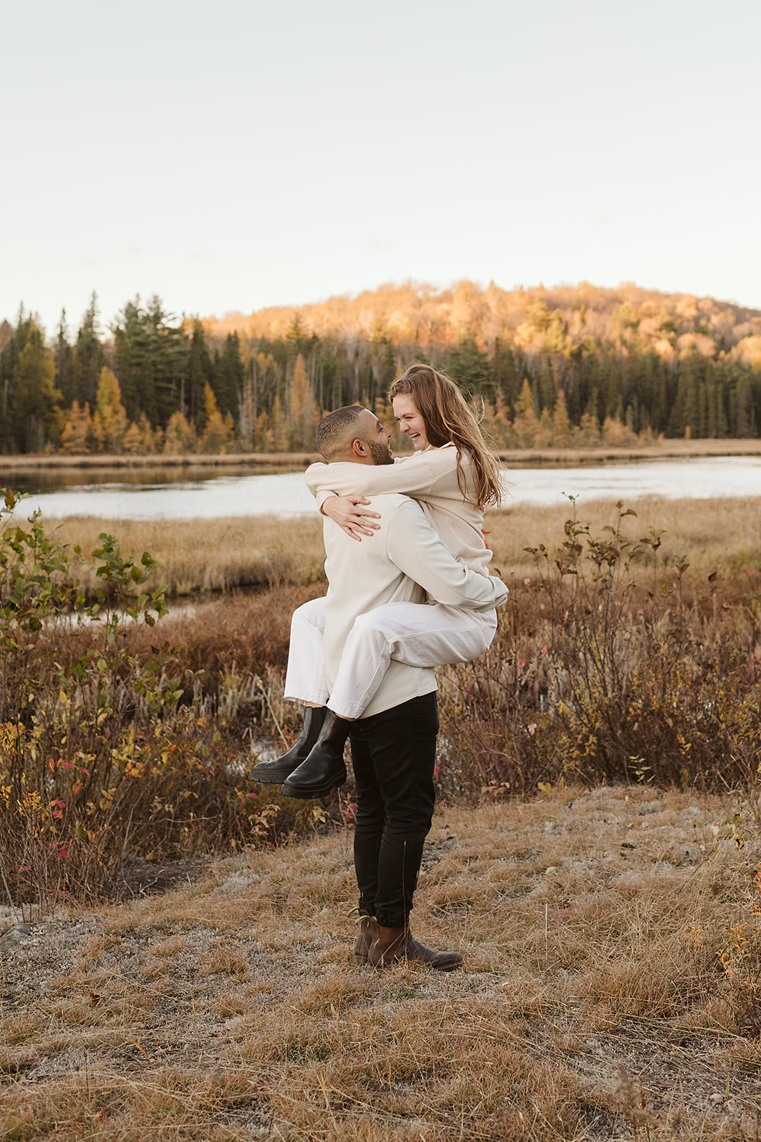 Engagement photos of this sweet couple at Algonquin Park who hiked, popped champagne and canoed at golden hour. 