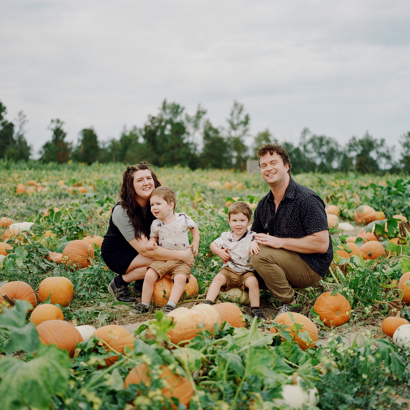 Family photos in pumpkin patch
