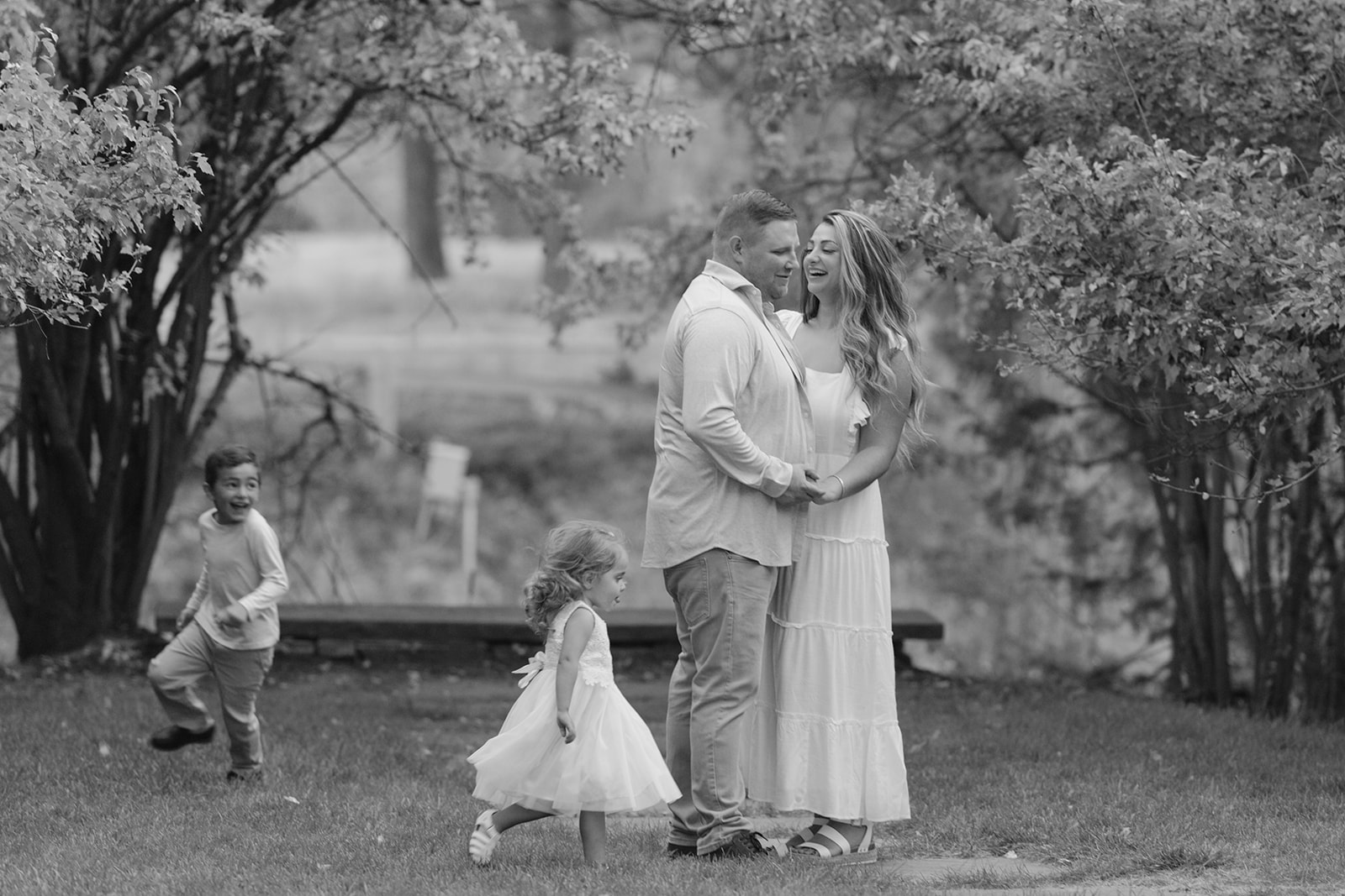 black and white family photos in castle rock colorado with pine trees and forest 80108
