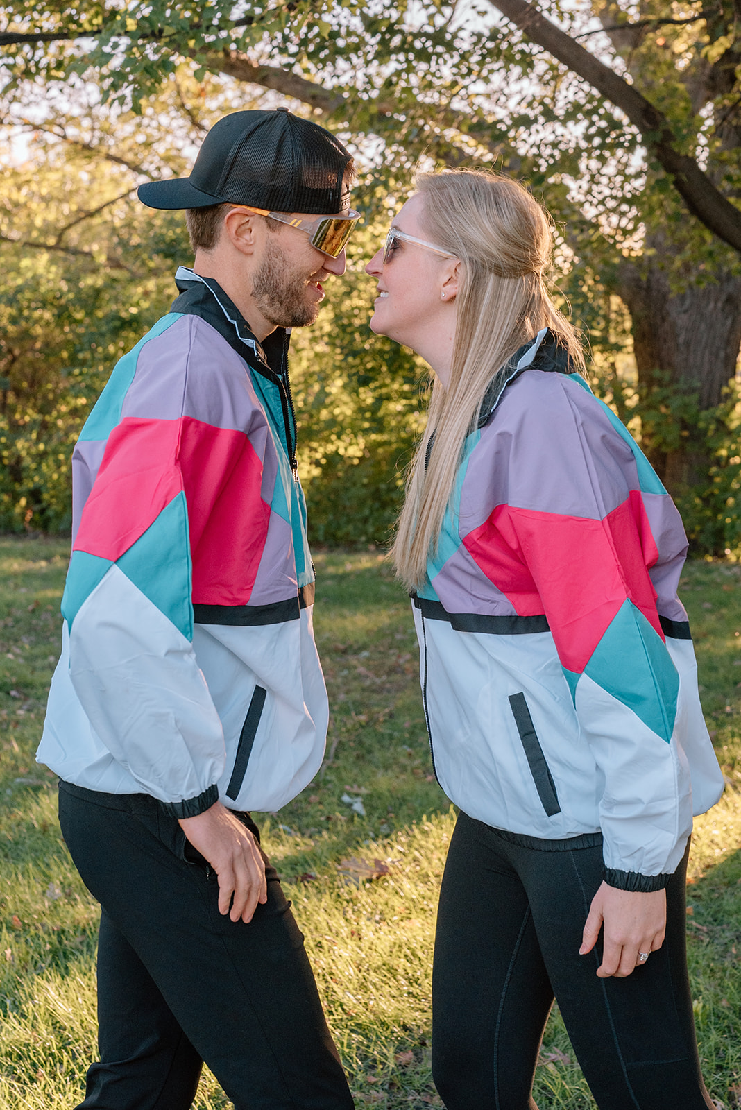 Silly engagement photos in windbreakers