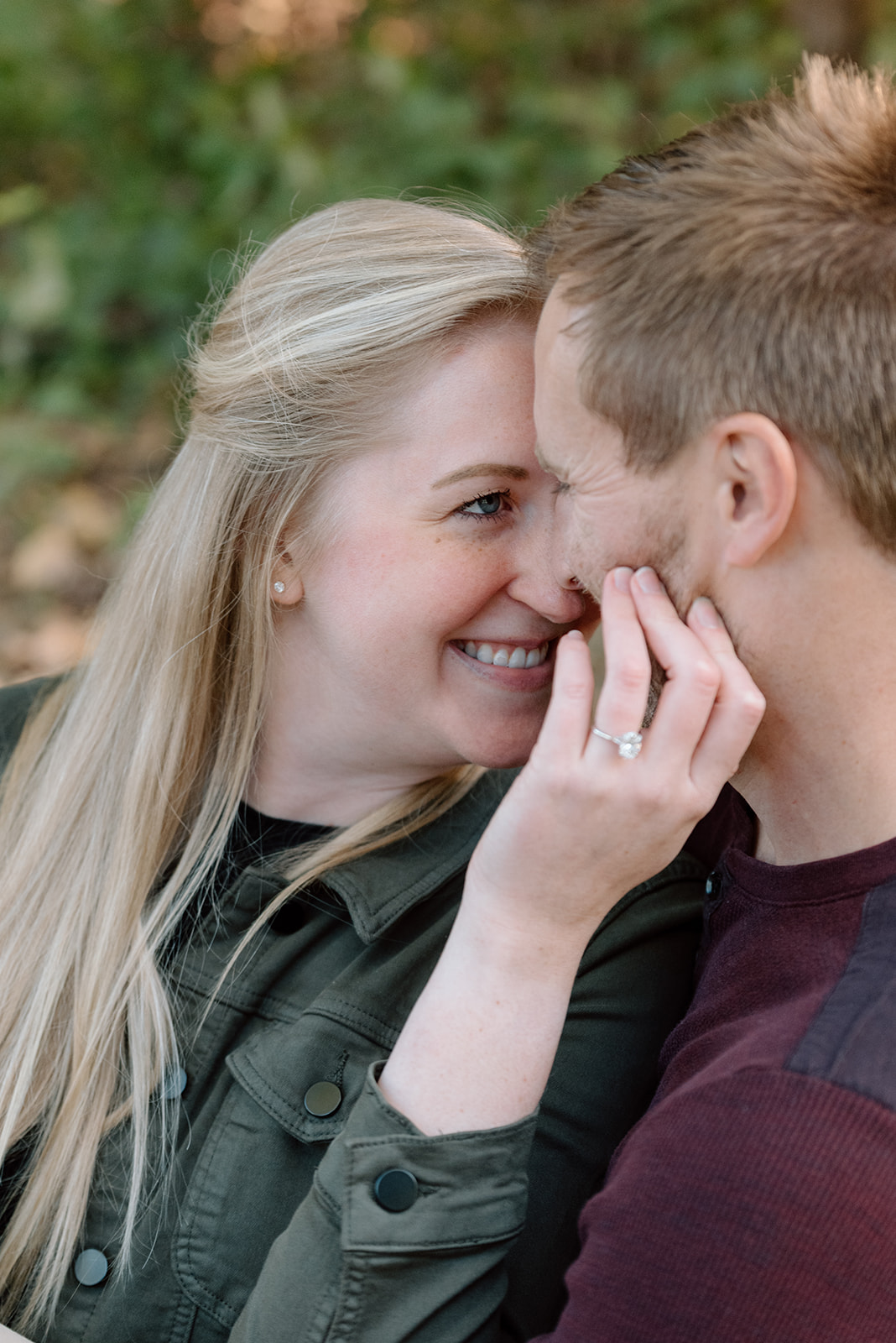 Woman snuggled up with her fiance Minneapolis engagement photos