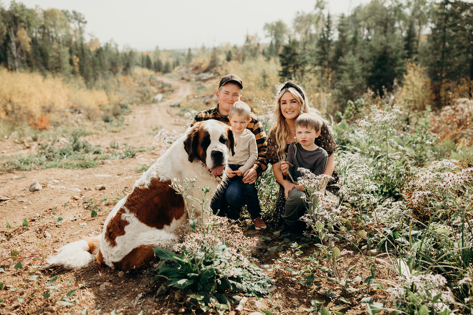 Family poses with dog during photoshoot in Thunder Bay, Ontario