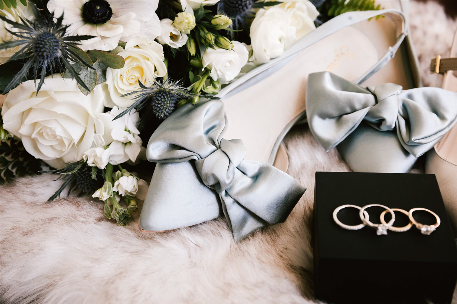 Bride's blue bow wedding shoes, a charming and sophisticated addition to her wedding day attire.