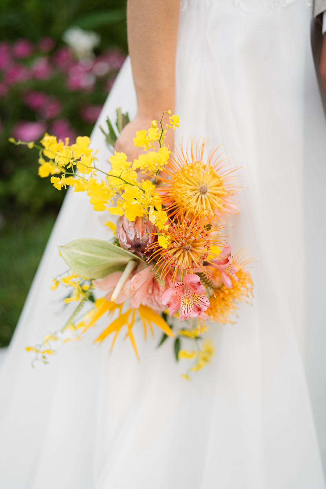 A bride holds her locally made tropical oahu bouquet