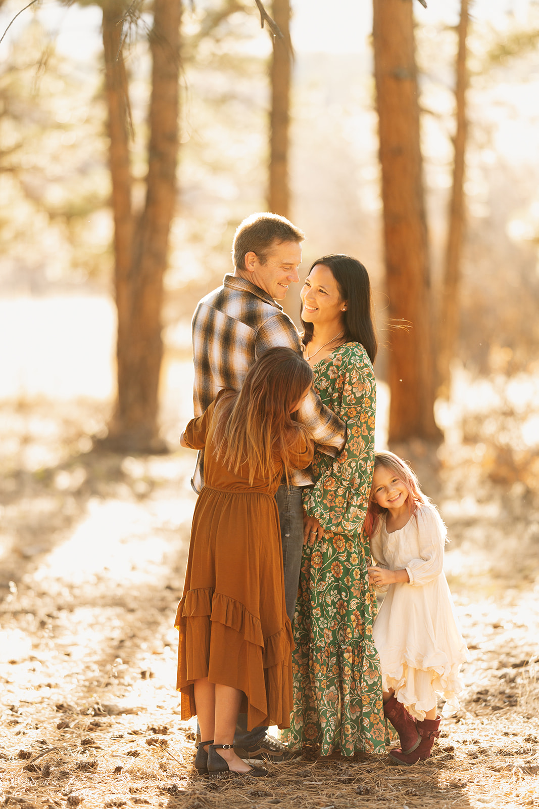 Colorado fall family photos, November in forest location with mountain background, neutral and natural outfit colors