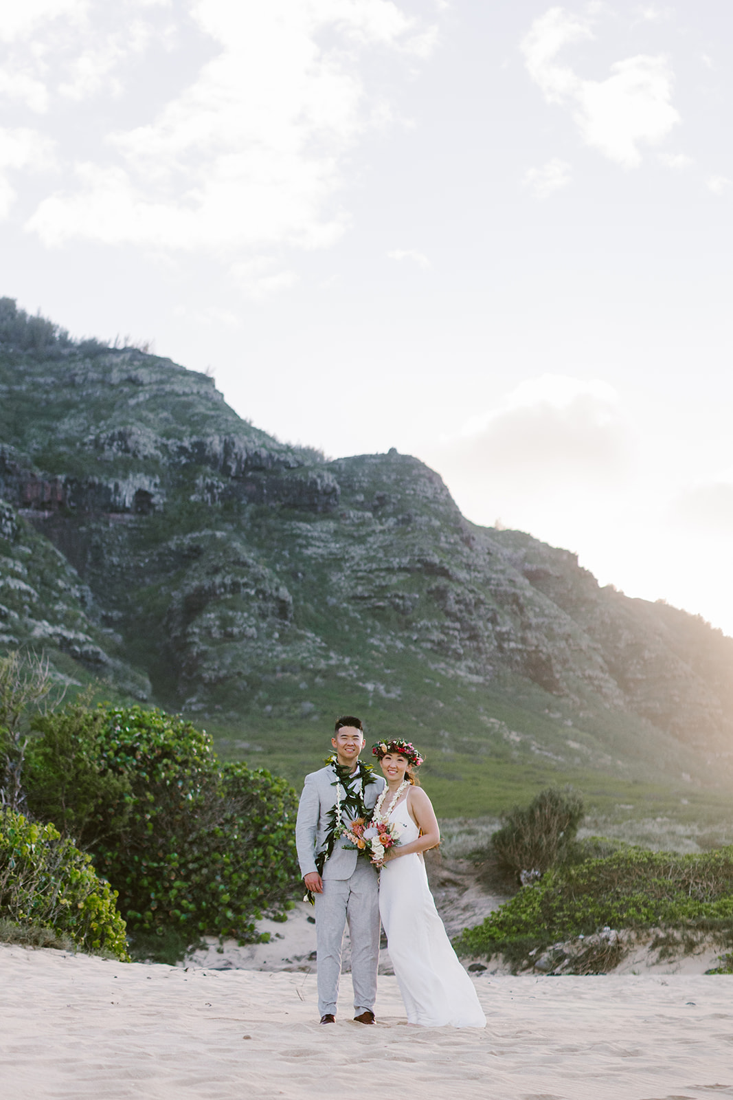 A couple who eloped on the North Shore of Oahu explore the mountains after getting married on a beach in Hawaii. 
