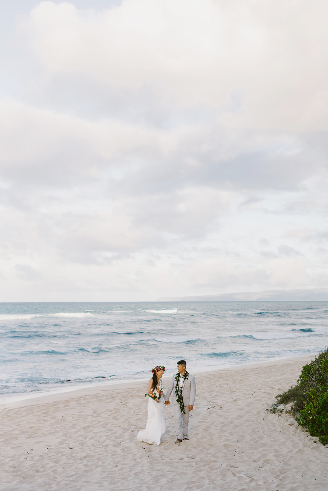 A couple who eloped on the North Shore of Oahu explore the mountains after getting married on a beach in Hawaii. 
