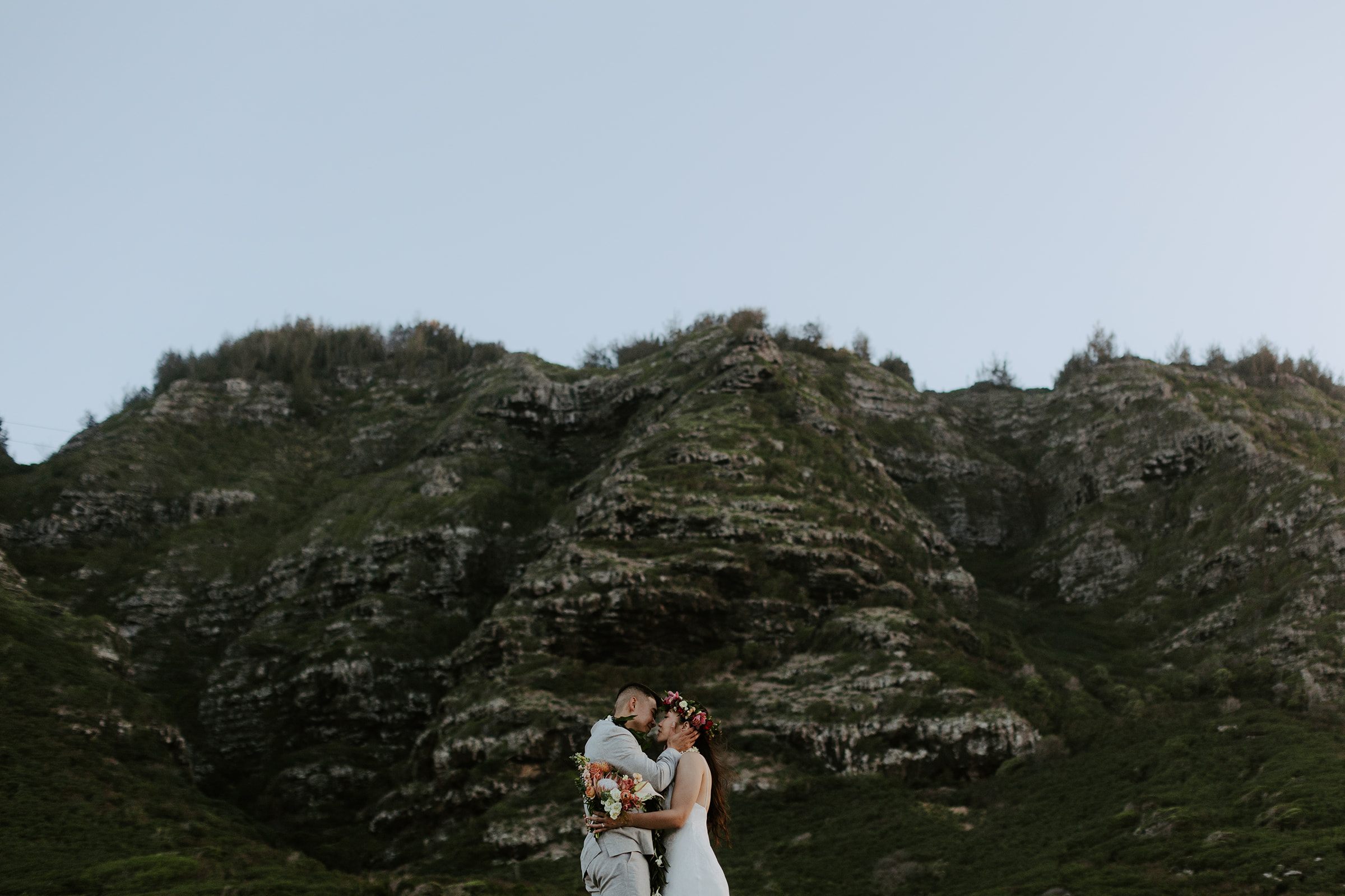 A couple who eloped on the North Shore of Oahu explore the mountains after getting married in Hawaii. 