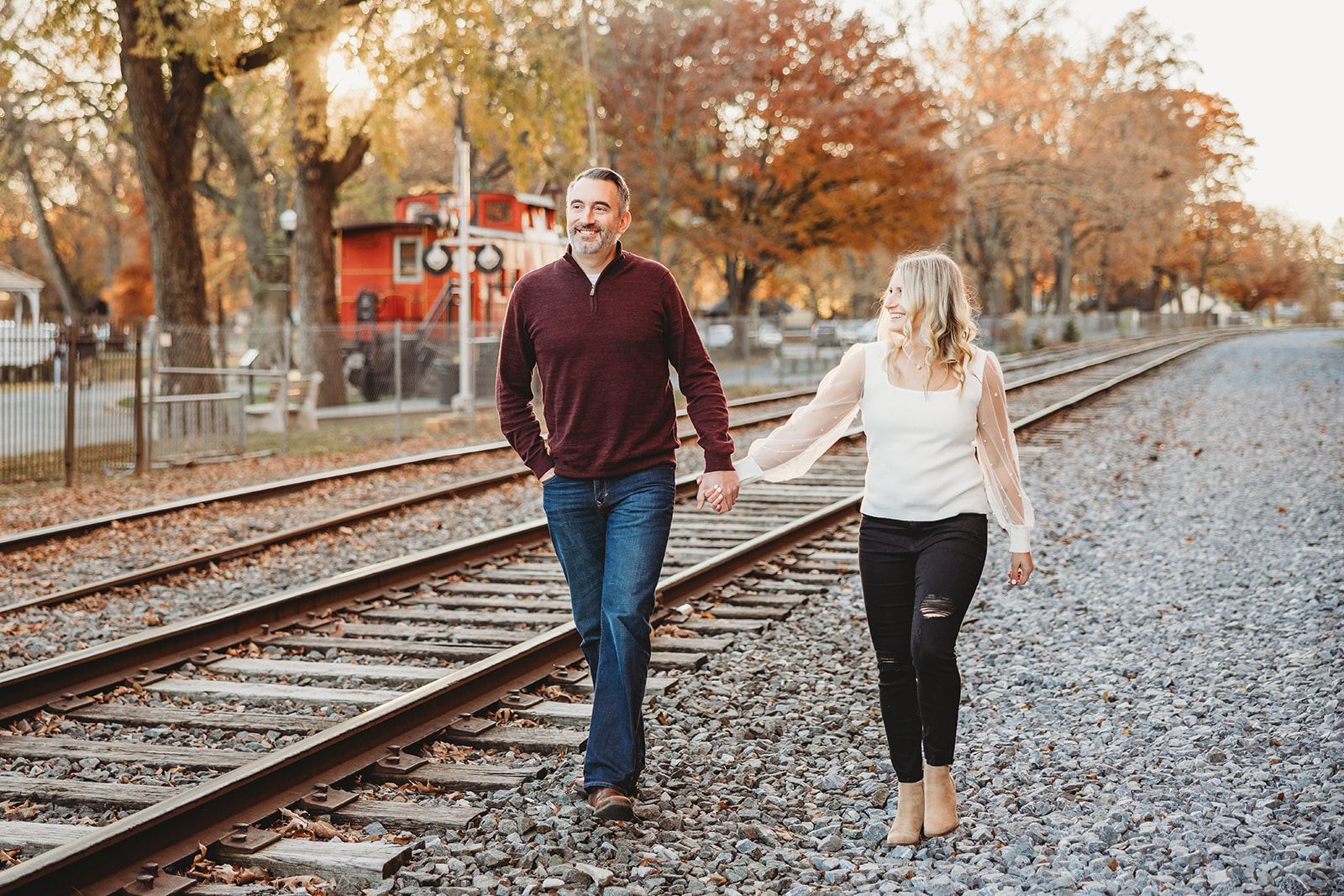 outdoor fall engagement session at Lititz Springs Park in central Pennsylvania Wilbur Buds railroad tracks