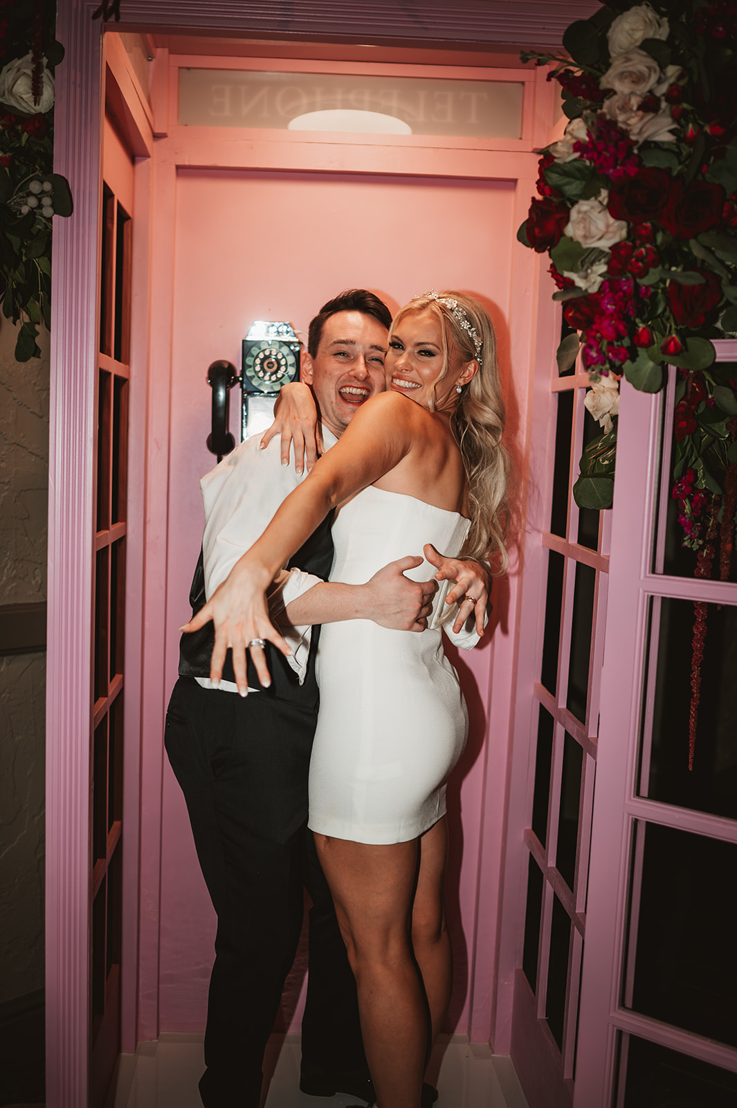 Chevy Chase Country Club Wedding Photo - Bride and groom in pink barbie phone booth