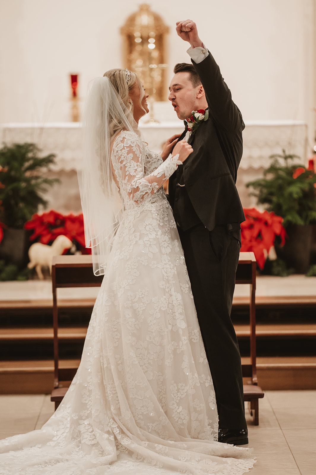 Chevy Chase Country Club Wedding Photo - ceremony in St James Catholic Church first kiss
