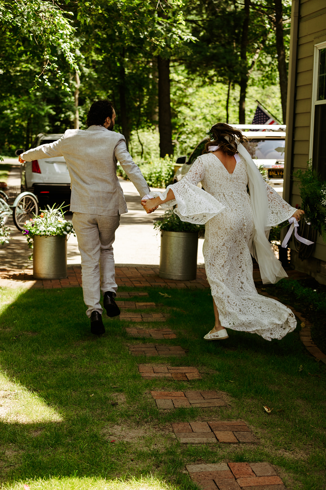 just married skipping down the isle backyard wedding Brianna Kirk Photography