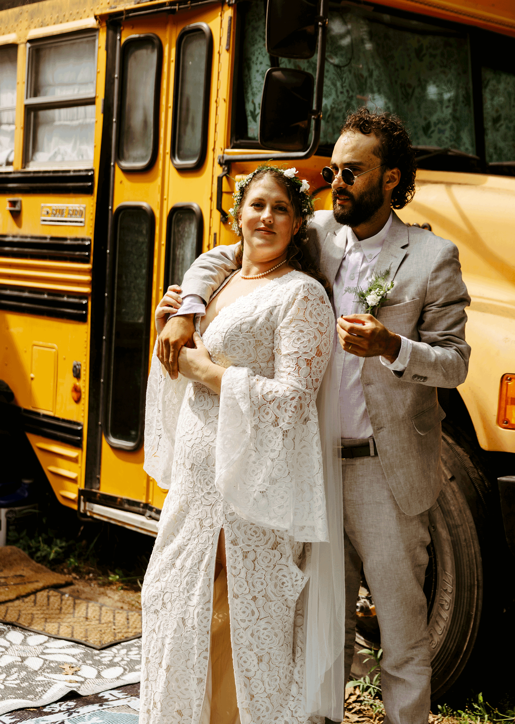 Trendy nomad wedding smoking a joint in front of their school bus tiny home Brianna Kirk Photography