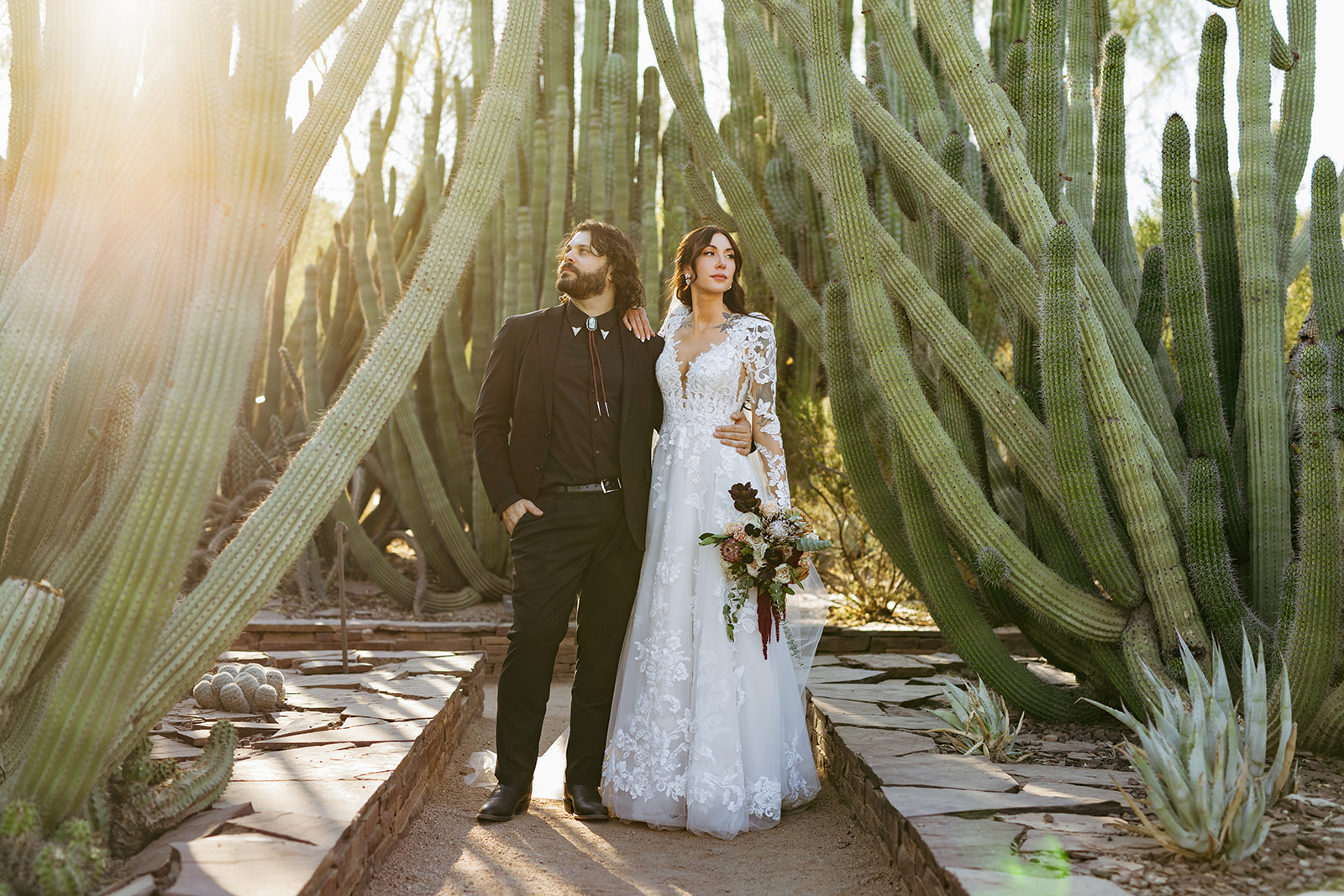 cinematic editorial bride and groom portraits sunflare with cacti desert botanical gardens brianna kirk photography