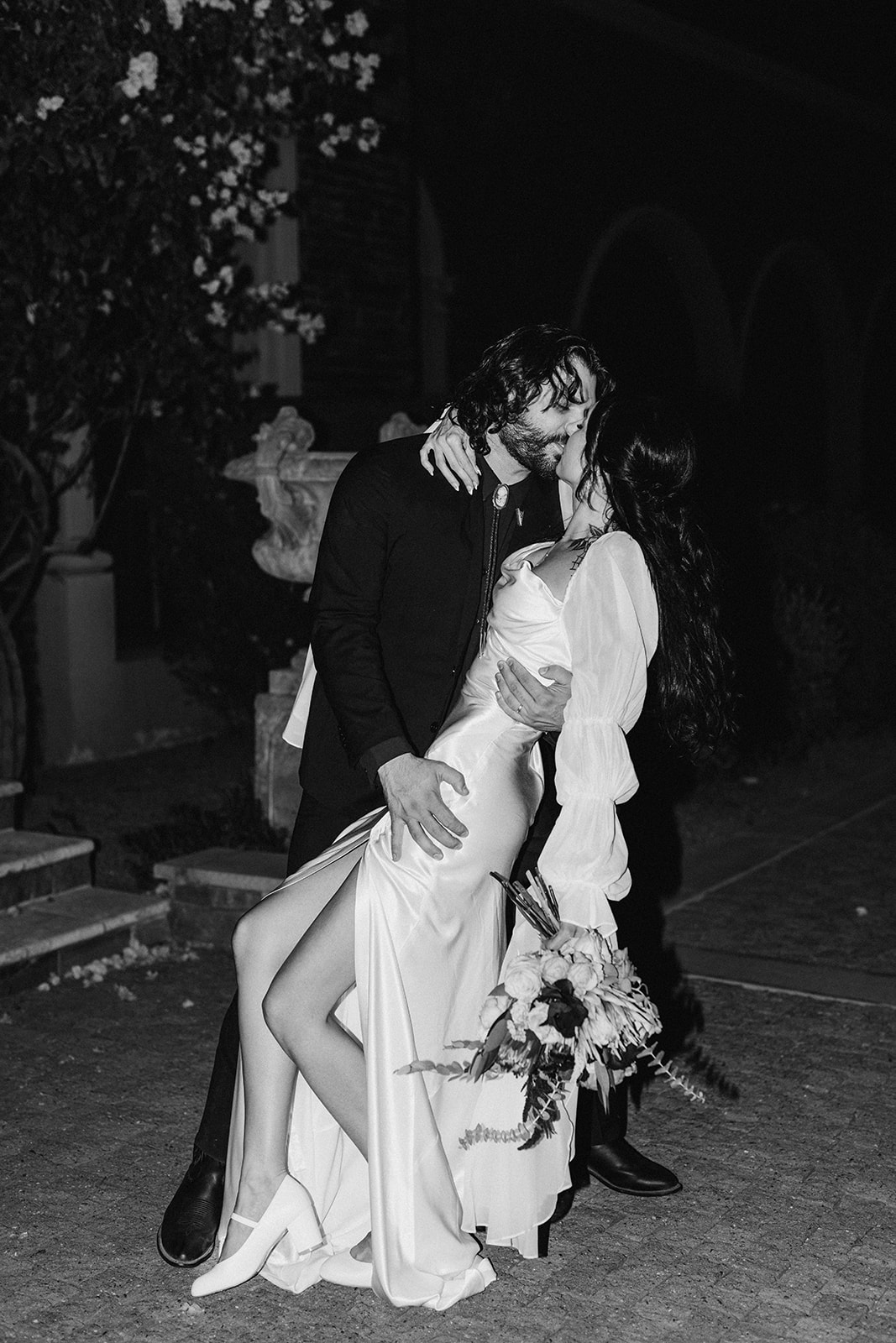 Vintage after party silk dress with long puffy sleeves direct flash creative film destination wedding brianna kirk photo