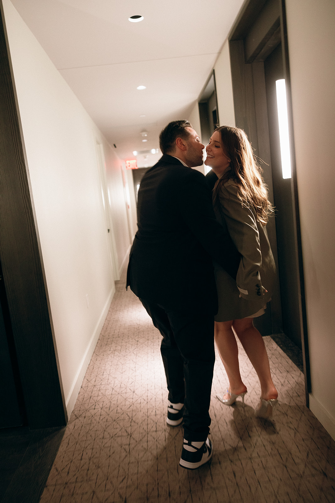 A couple who eloped in NYC run through their hotel hallways