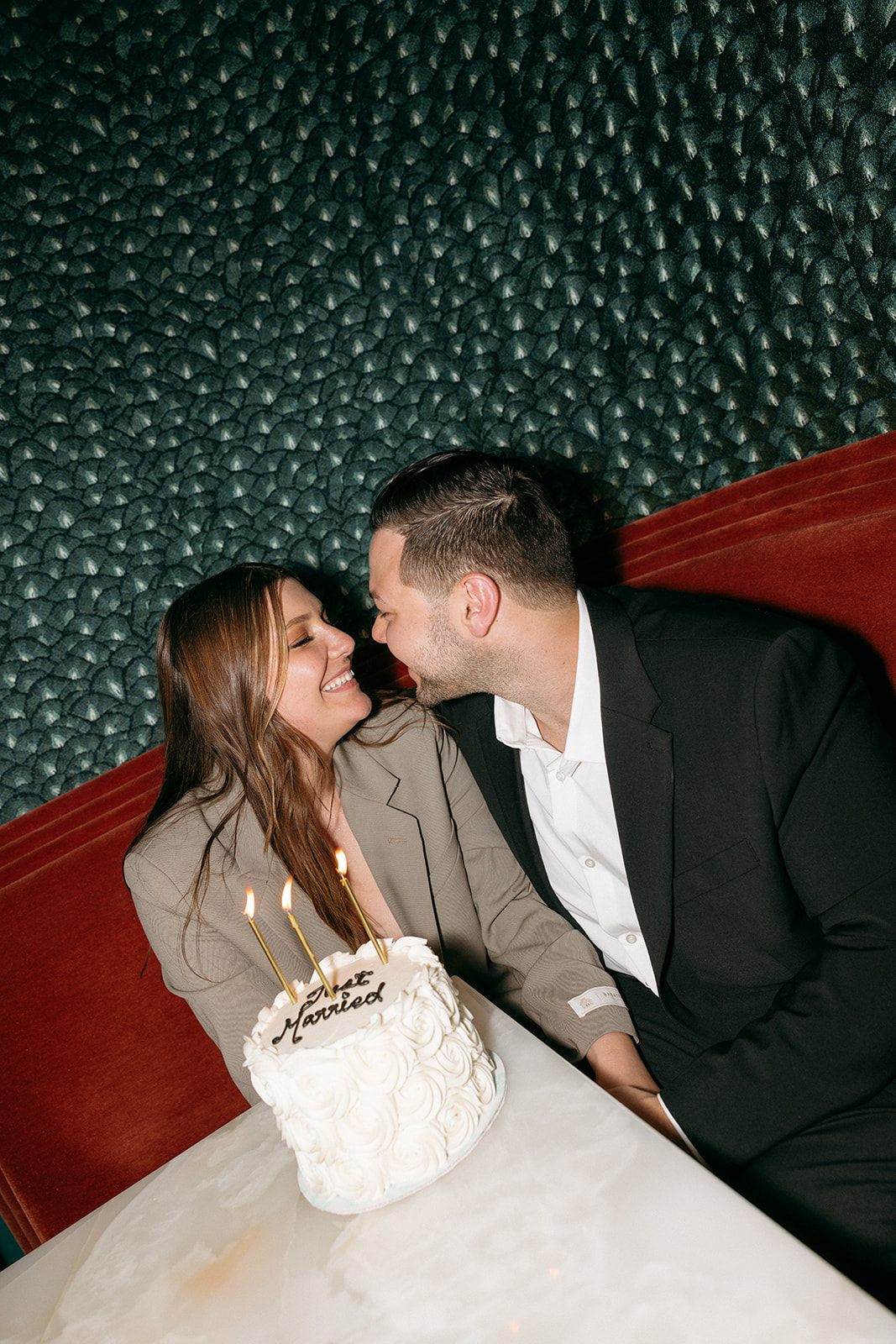 A couple who eloped in NYC blow our their mini wedding cake candles