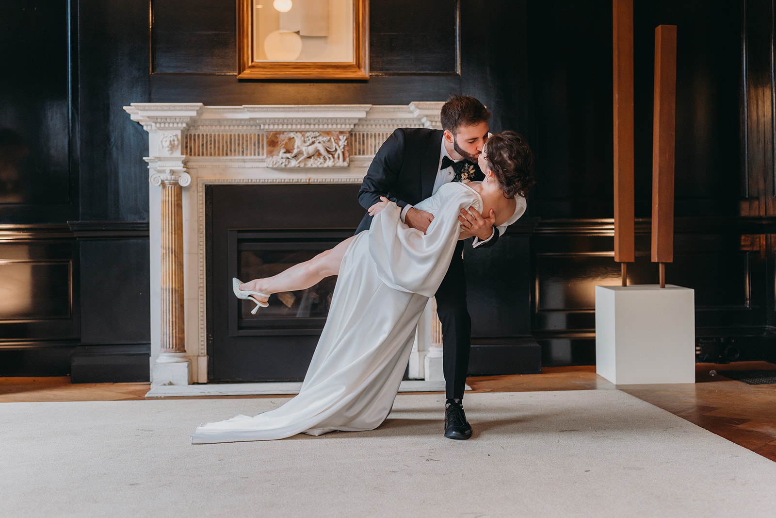 bride and groom dip and kiss at Patterson Mansion Wedding in Washington DC