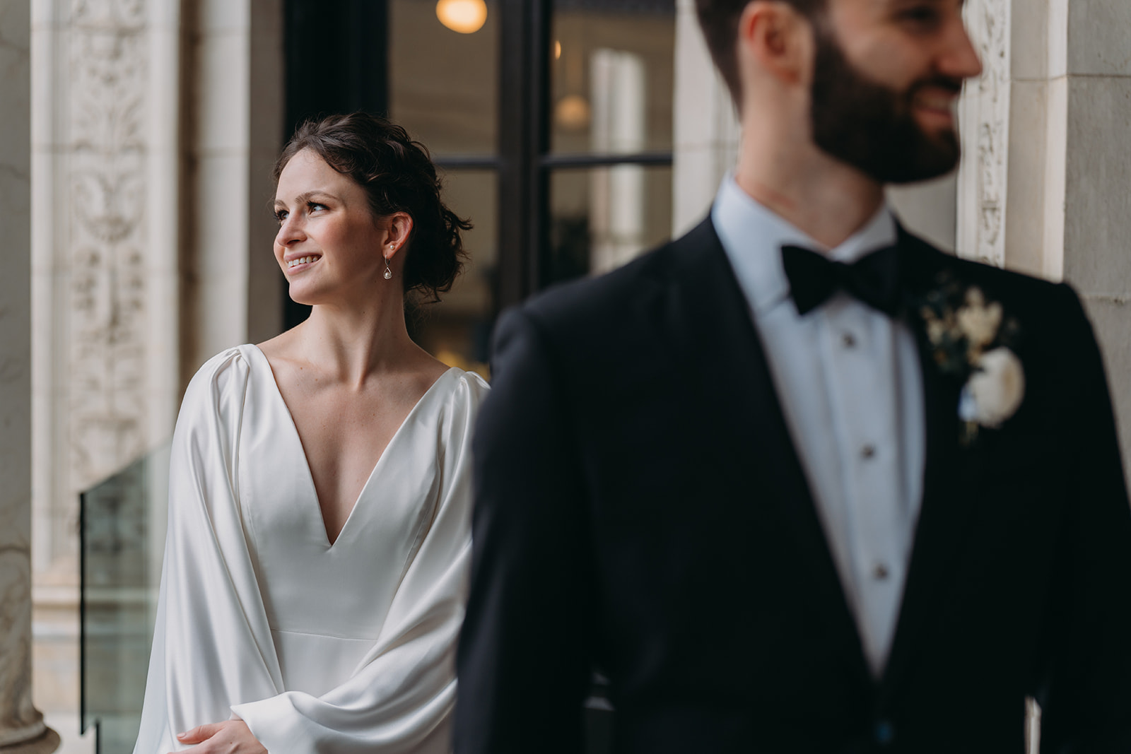 bride and groom look separate ways at Patterson Mansion wedding  in Washington DC